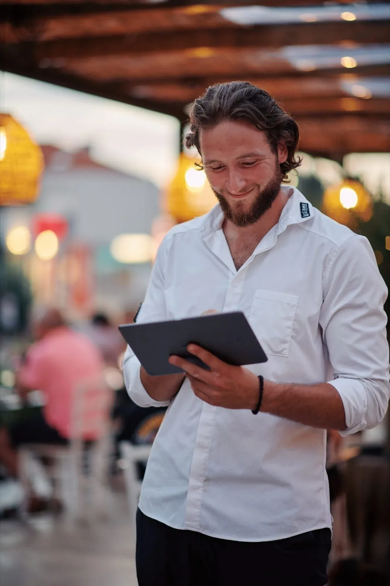 Danilo Brajković managing reservations on the terrace